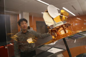 Eiichiro Komatsu with a model of WMAP Satellite(Image Credit: Hiroto Kawabata)