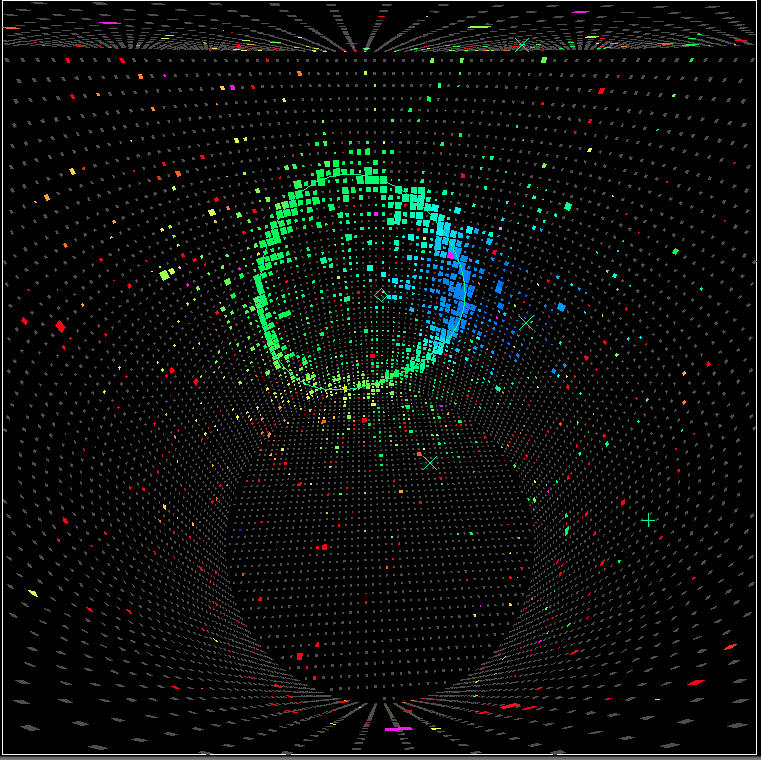 図 4: 電子型ニュートリノ出現事象候補の例:                   円筒形をしたスーパーカミオカンデの3次元イベントディスプレイで、内壁に配置された光電子増倍管のうち、光を捉えたものに時間別の色をつけて表示している。電子型ニュートリノと水との反応によって発生した電子が引き起こす電子・陽電子シャワーが発したチェレンコフ光が、リング状に捉えられているのがわかる。なお、本事象は2012年3月、東日本大震災からの復旧の後に初めて得られた電子型ニュートリノ出現事象の候補である。    