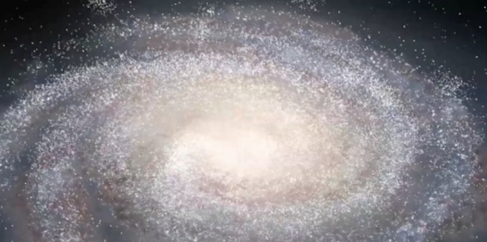 図1:   SDSSデータを用いた宇宙のアニメーションの１シーン。この画像は天の川銀河を示しています。銀河の形は想像によるもので、小さな白い点はSDSSで得   られた数十万もの星々を一つ一つ示しています。